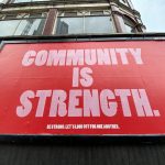 "Community is strength" billboard