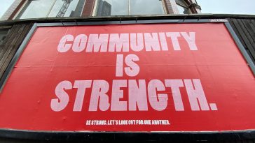 "Community is strength" billboard