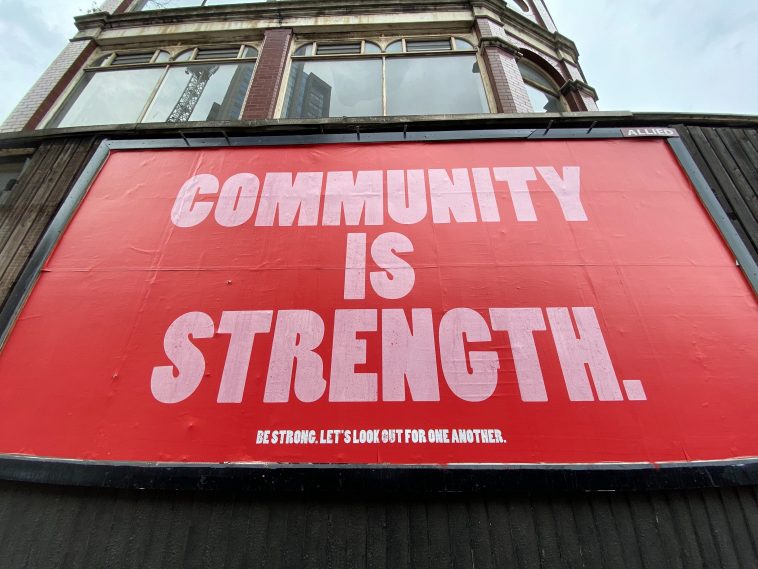 "Community is strength" billboard