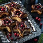 Christmas themed baked cranberry pastry on a plate