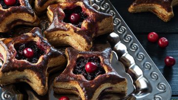 Christmas themed baked cranberry pastry on a plate